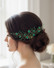 Woman with elegant hair styled with a green decorative headpiece against a soft background