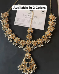 A detailed image of a golden Mathapatti, a traditional Indian head accessory, with intricate designs and small pearl embellishments. A 'Thank you' card is also visible, indicating the product's packaging.
