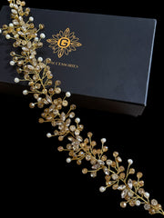Gold and pearl hair accessory in front of a black box with 'G Accessories' branding.