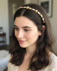 Woman wearing a decorative headband with a blurred indoor background