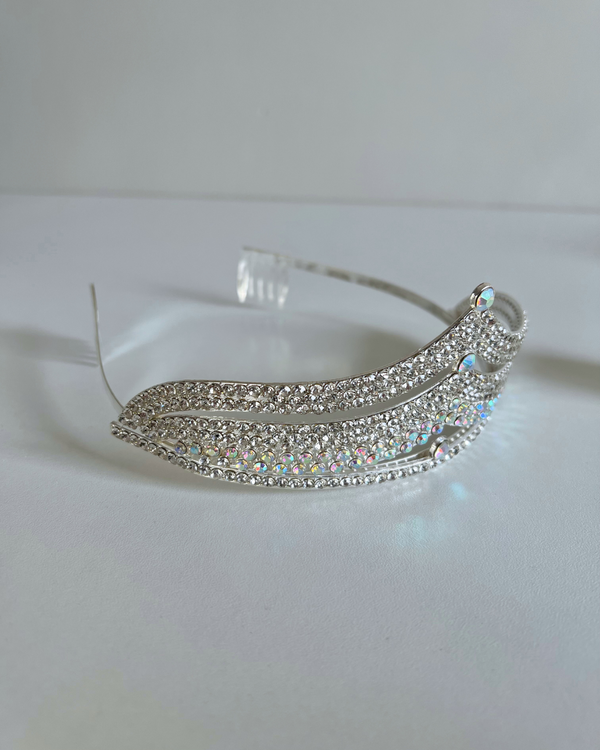 Silver tiara with gemstones on a white background