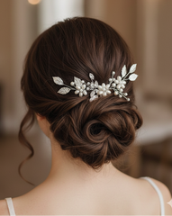 Woman with elegant hair styled with a decorative hairpiece in an indoor setting
